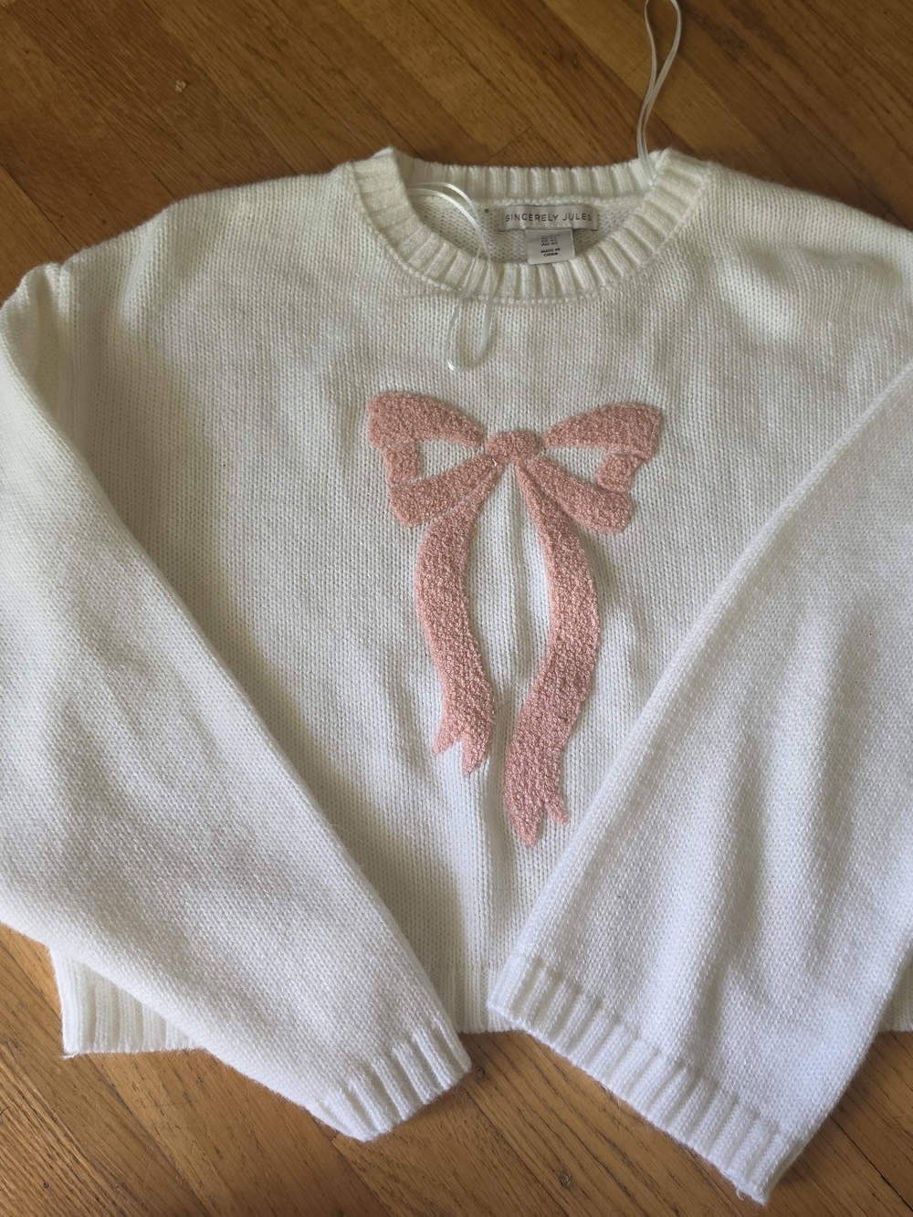Cream Women's Sweater with Pink Bow Accent -